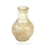 A small 18th century glass bottle with twisted neck; 6.5 cm high.