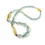 A high ct yellow metal, Santorini aquamarine and ruby necklace