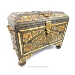 A North African twin handled trunk, inlaid with bone and embossed white metal