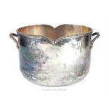 A silver plated Christian Dior ice bucket of oval form, having a beaded border and twin handles