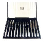 A George V Art Deco cased set of six silver handled fruit knives and forks