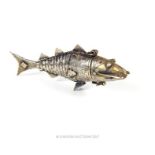 A small 19th century silver Indian pefume bottle in the form of articulated fish, 8cm long
