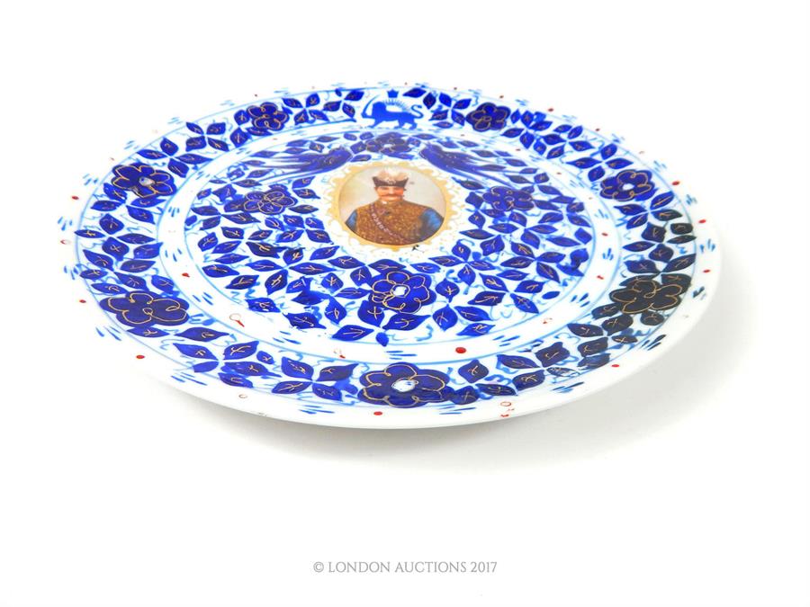 An early 20th century Persian blue and white plate, featuring Nazerldin Shah, with gold - Image 3 of 3