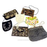 A collection of vintage ladies evening bags, to include three early 20th century bead work