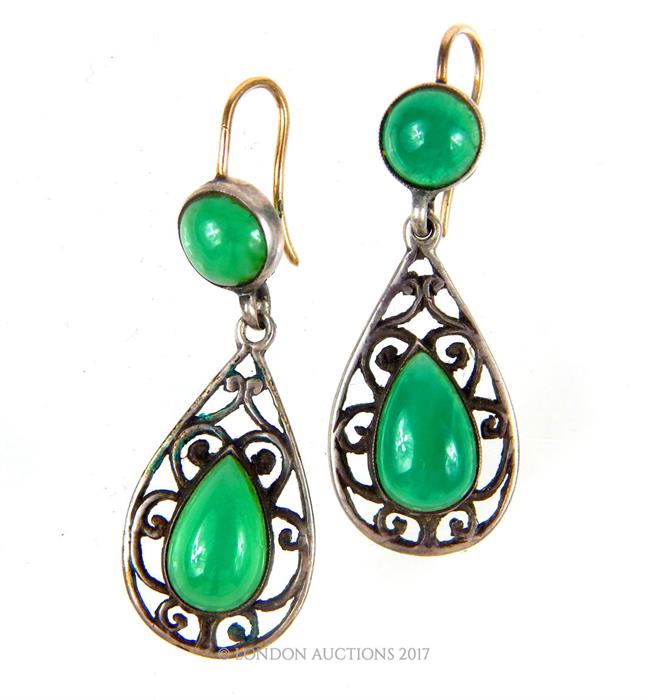 A pair of Art Nouveau green agate earrings with silver openwork mounts