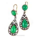 A pair of Art Nouveau green agate earrings with silver openwork mounts