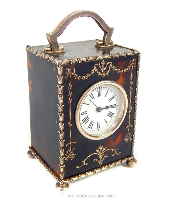 A fine, George V silver and tortoiseshell carriage clock