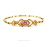 A high carat yellow metal bracelet,set with a marquise cut pink stone and diamond chips, 18 cm long,
