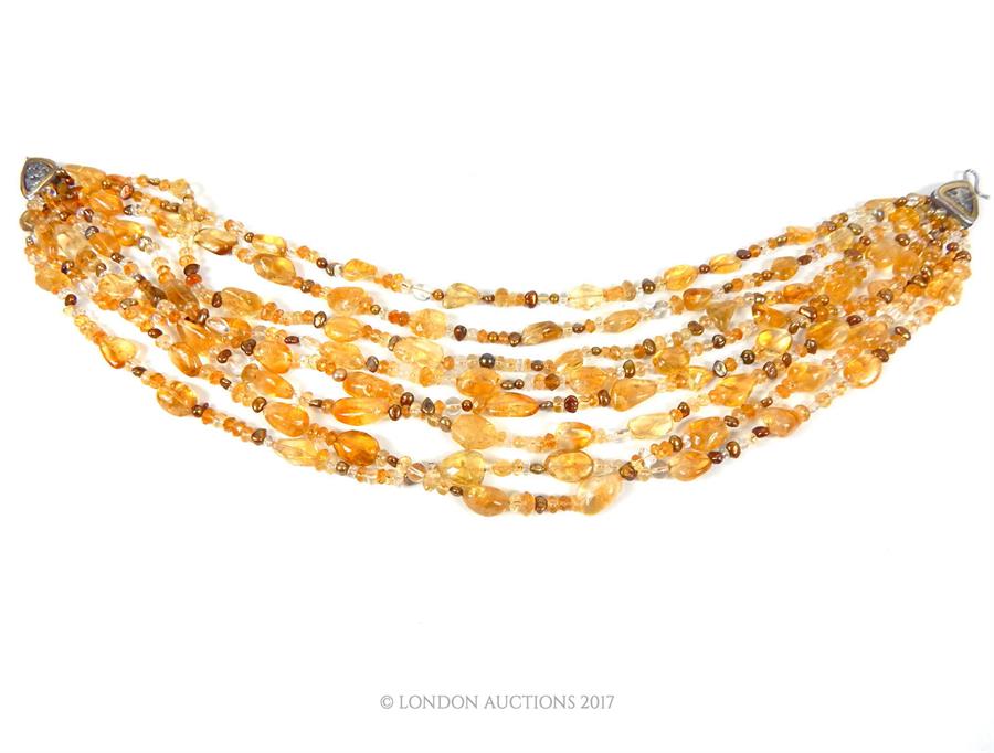An eight strand honey coloured quartz and pearl necklace, with silver clasp, 48 cm long - Image 2 of 3