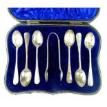An Edwardian cased set of six silver Hanoverian pattern coffee spoons and tongs