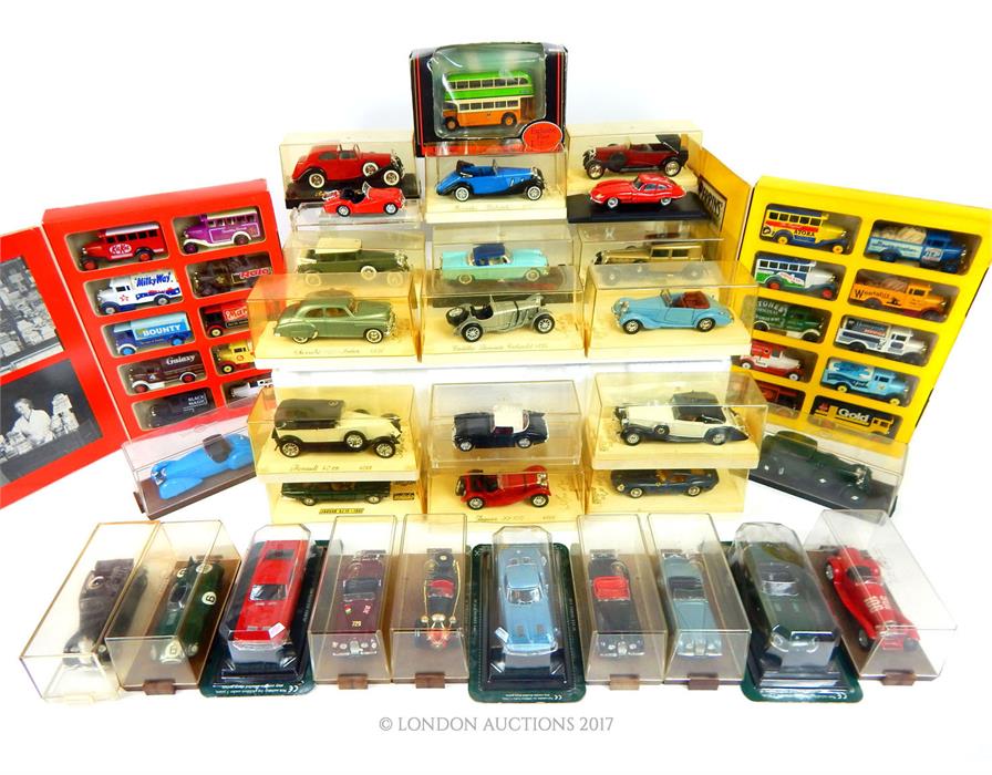 A large quantity of various model toy cars, all boxed and cased, including examples by Brumm