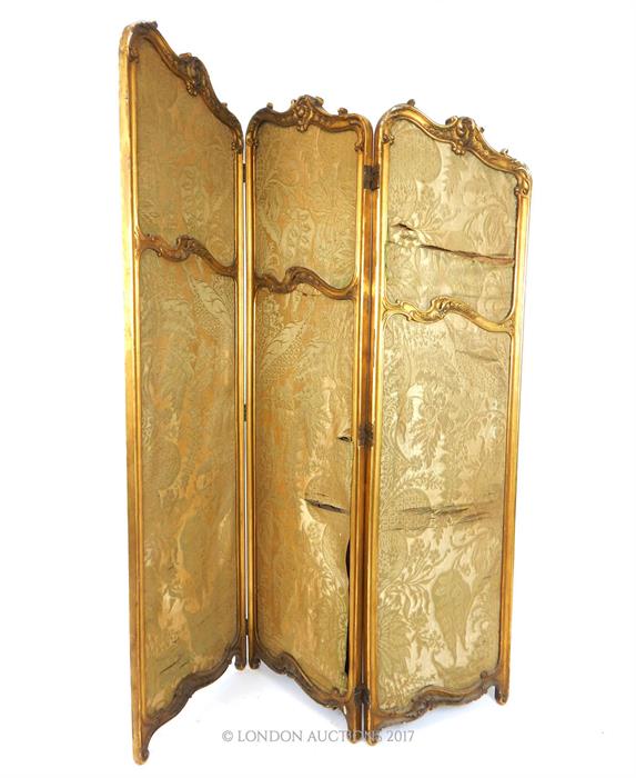 A 19th century Rococo design gilt gesso two fold, three panel floor standing vanity screen