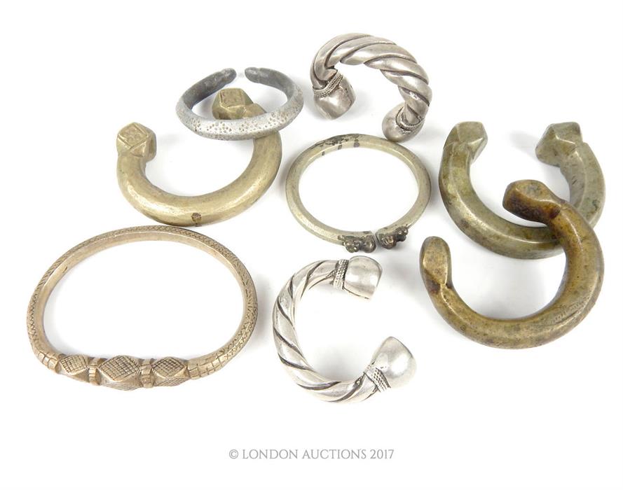 A selection of Bedouin white metal jewellery, comprising; two large rings mounted with intaglio