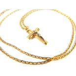 An 18ct gold gold chain, marked 750, 61 cm long, with yellow metal crucifix pendant3 cm long
