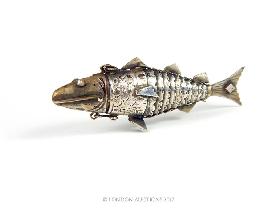 A small 19th century silver Indian pefume bottle in the form of articulated fish, 8cm long - Image 2 of 3