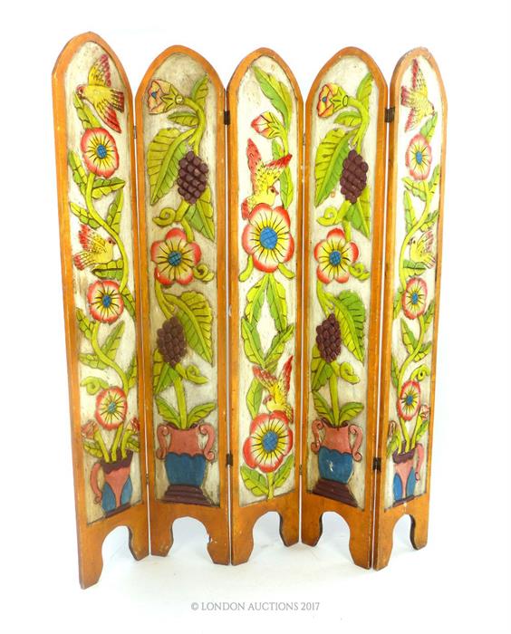 A brightly painted carved Mexican teak four fold screen, with arched top, carved with animals and - Image 4 of 5