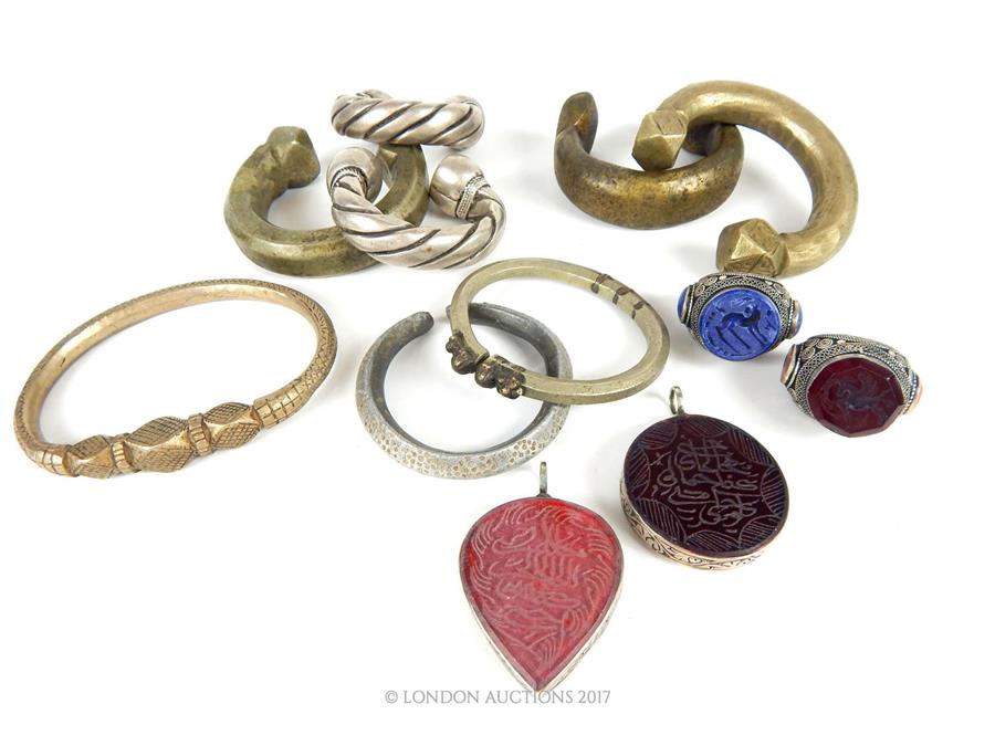 A selection of Bedouin white metal jewellery, comprising; two large rings mounted with intaglio - Image 3 of 5