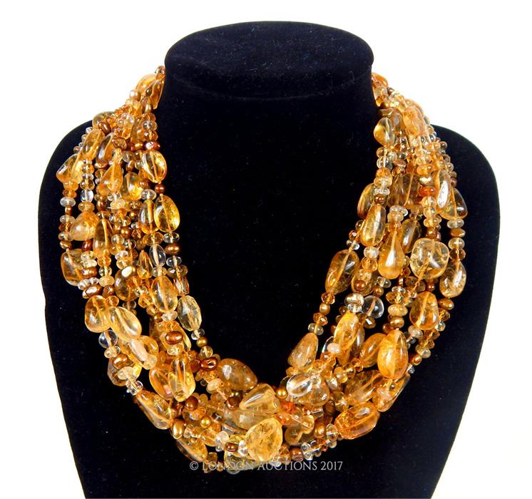 An eight strand honey coloured quartz and pearl necklace, with silver clasp, 48 cm long