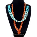 A turquoise and faux pearl necklace together with a quartz necklace.