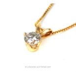 An 18 ct yellow gold, diamond solitaire pendant and chain