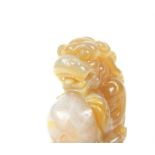 A Chinese carved agate dragon; 7.5 cm long.