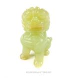 A Chinese carved jade Dog of Fo, seated on its back legs
