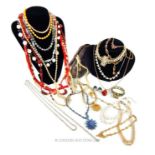 A large quantity of costume jewellery necklaces, including faux pearl necklaces