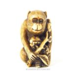 An early 20th century netsuki of a monkey