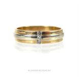 A 9ct yellow and white gold three diamond ring