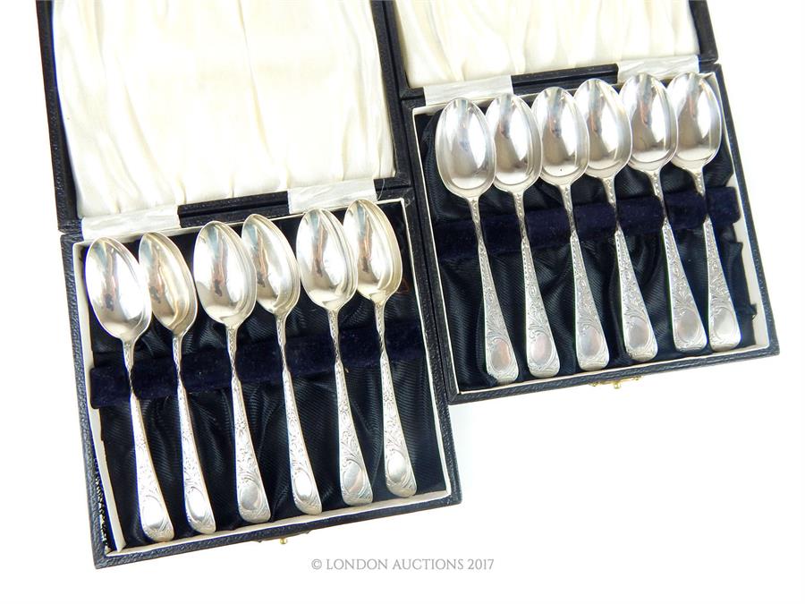 A set of twelve Victorian hallmarked sterling silver tea spoons in two cases