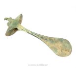 An ancient eastern bronze hammer hilt; 24 cm long.