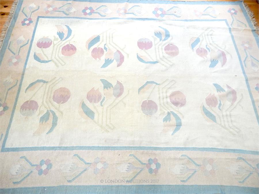 A large Indian kelim carpet, decorated with flowers on an ivory field - Image 2 of 3