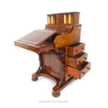 A Victorian walnut Davenport, by B Taylor & Sons of 16 Great Dover Street, Borough, London