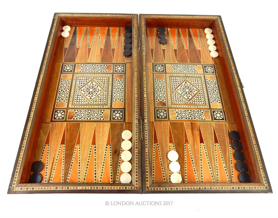 A North African inlaid folding chess board, complete with draughts pieces - Image 2 of 3