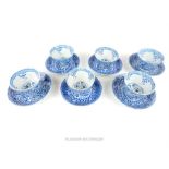 A set of six Chinese Ming style blue and white porcelain tea bowls and saucers, decorated with