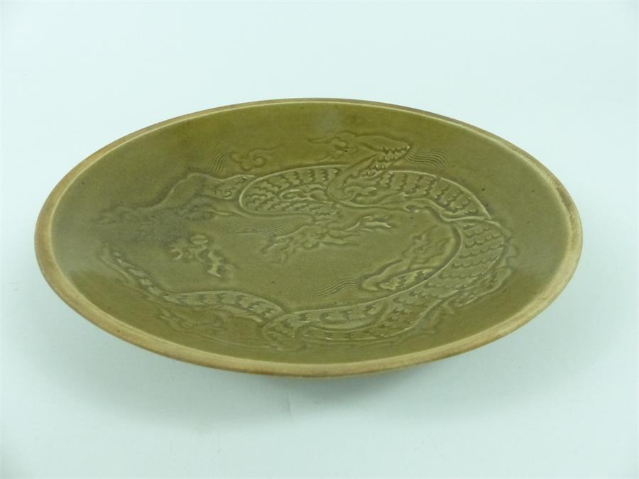 A Chinese Song style green glazed shallow dish