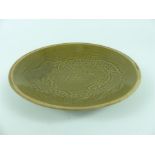 A Chinese Song style green glazed shallow dish