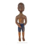 A mid 20th century painted Ashanti figure of a standing man, in the style of Osei Bonsu (Ghana),