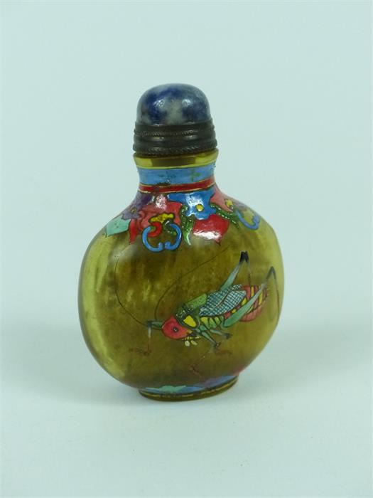 A Chinese glass snuff bottle, decorated in colour enamel with a grass hopper, four character mark to