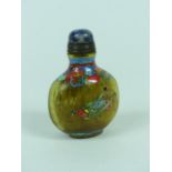 A Chinese glass snuff bottle, decorated in colour enamel with a grass hopper, four character mark to