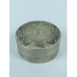 Chinese white metal circular pot, the lid inset with a coin 6.2 cm diameter, together with five