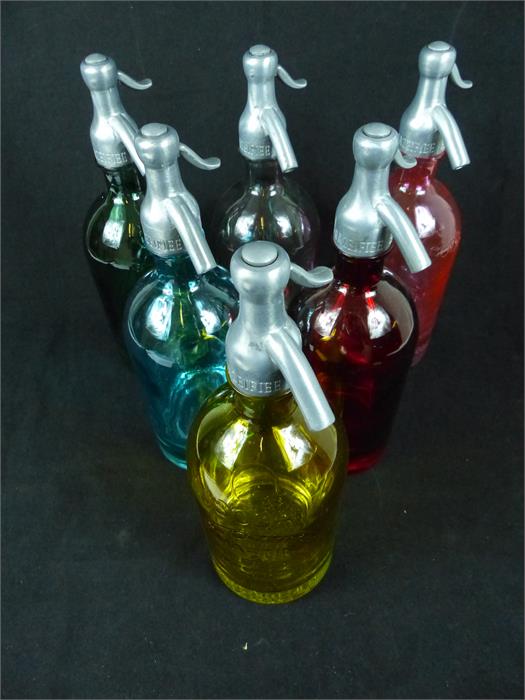 A harlequin set of six coloured glass artisan soda syphons