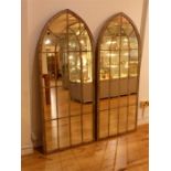 A pair of Gothic style arched topped garden mirrors.