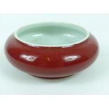 A Chinese sang de boeuf bowl, six character mark to base, 15 cm diameter