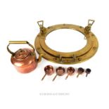 A circular brass porthole mirror, together with a set of five miniature copper saucepans