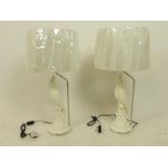 A pair of composite white cockatoo lamps with shades.