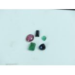 Loose gemstones, comprising a step cut emerald, 9 x 6 mm, a pear cut emerald, a pear cut sapphire, a