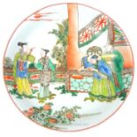 A Chinese dish decorated with figures; bearing a six character mark to its base