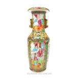 A late 19th century hand painted Chinese Cantonese vase in the famille rose palette