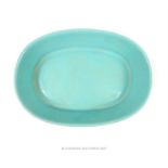 A Chinese, turquoise glazed, oblong dish raised upon four feet